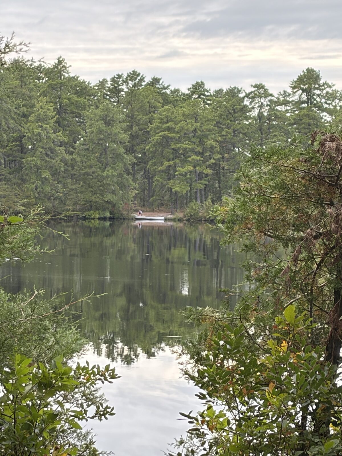 Across the lake, my son at the canoe on the far shore.