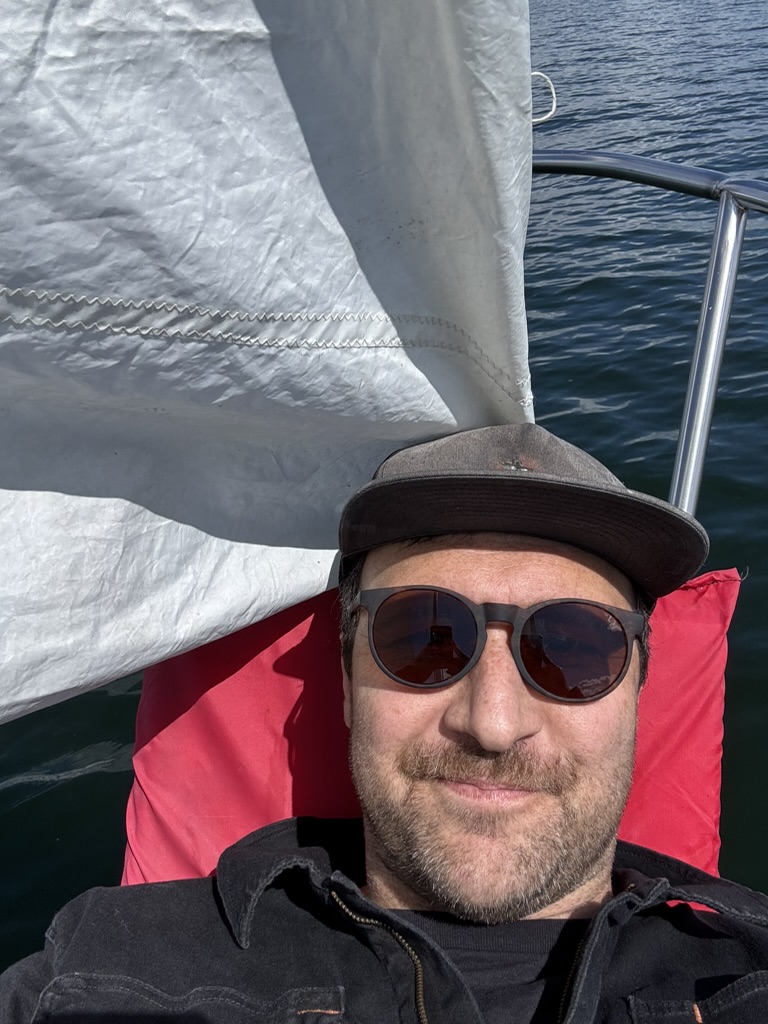 Will leaning against Jasmine's bowsprit.